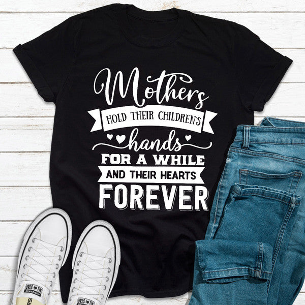 Mothers Hold Their Children's Hands For A While