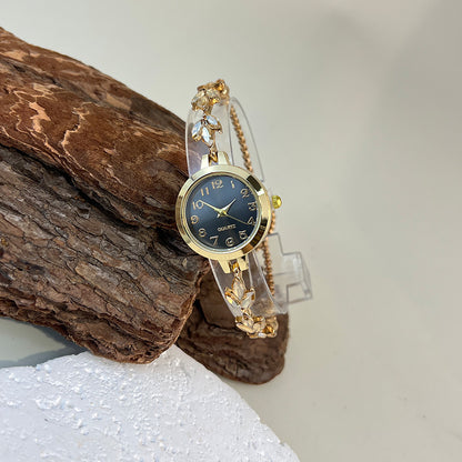 Elegant Ladies Quartz Watch, Round Alloy Case, Arabic Numeral Dial, Leaf-Shaped Diamond-Studded Bracelet