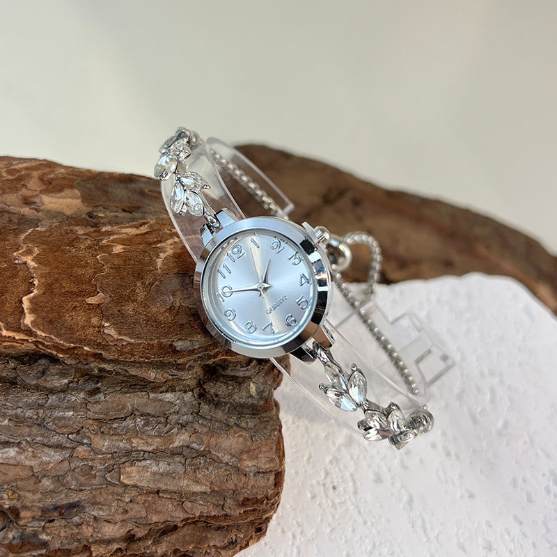 Elegant Ladies Quartz Watch, Round Alloy Case, Arabic Numeral Dial, Leaf-Shaped Diamond-Studded Bracelet